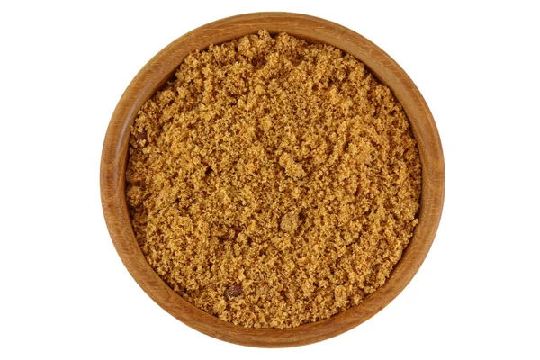 Açúcar mascavo natural cru não refinado na cor marrom em uma tigela de madeira — Fotografia de Stock