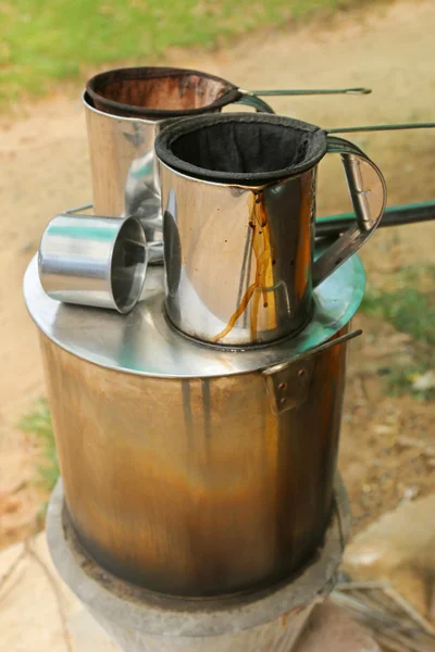 Pot of hot water boiler on wood fueled stove with coffee filter strainer bag — Stock Photo, Image