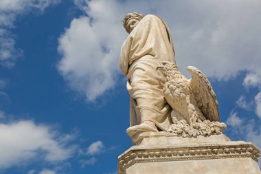 Eagle and statue of Durante degli Alighieri, also called Dante in Florence, Italy clipart