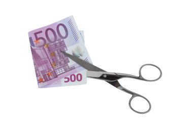 Silver scissors cutting folded five hundred 500 Euro banknote money bill isolated on white clipart