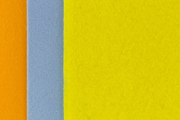 Φωτογραφία: υφή closeup σούπερ απορροφητικό υφάσματα σε πορτοκαλί κίτρινο μπλε — Φωτογραφία Αρχείου