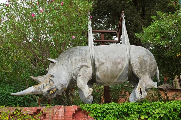 Status of suspended rhinoceros rhino sculpture hanging in  Portofino, Liguria, Italy — Stock Photo, Image