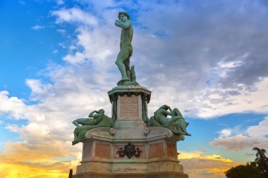Statue of David at Michelangelo Square on hill in evening during sunset, Florence, Italy  clipart