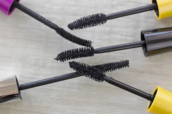 Various mascara brushes, cosmetic to enhance eyelashes from different brands — Stock Photo, Image