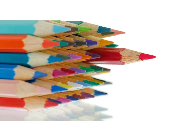 Close up tip of colorful colored pencils with sharp red one standing out — Stock Photo, Image