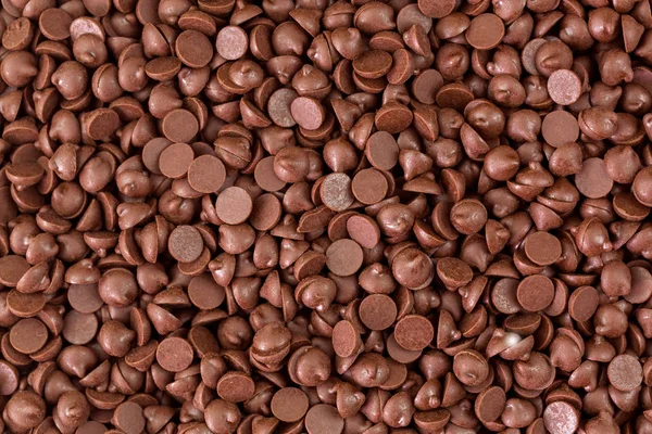 Textura de pequenos pedaços de fundo chips de chocolate adoçado — Fotografia de Stock