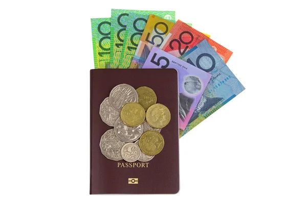 Australian dollar banknote (AUD) and coins on Passport isolated on white — Stock Photo, Image