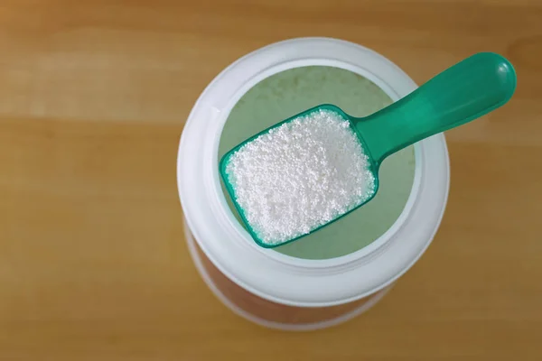 グリーン ランドリー スプーン ランドリー浸す粉の完全の平面図 — ストック写真