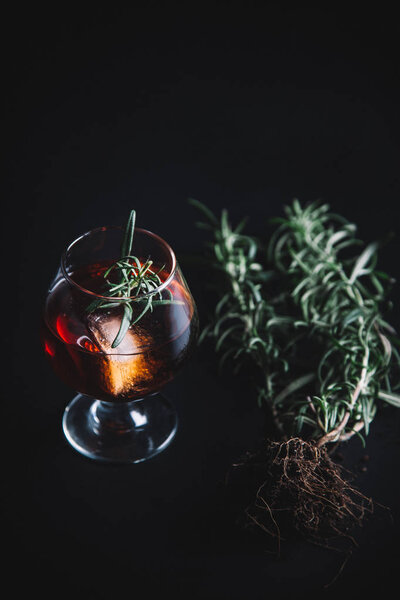 Alcoholic cocktail on dark moody background