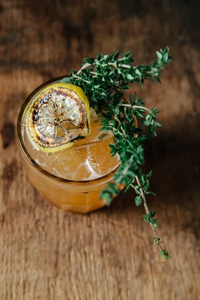 Specialty bourbon cocktail with torched thyme — Stock Photo, Image