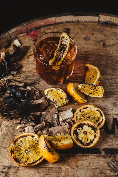 Smoked old fashioned cocktail on dark wooden background — Stock Photo, Image