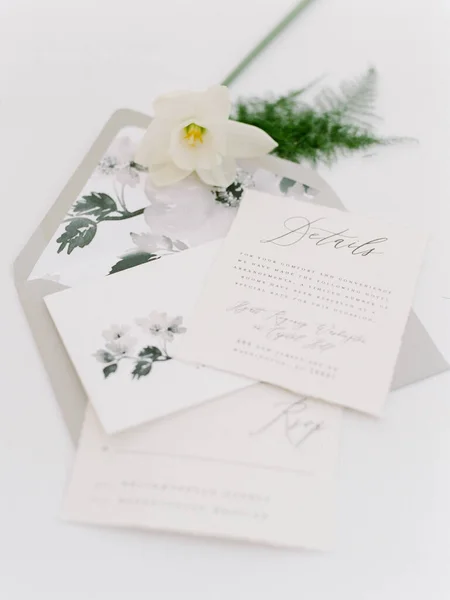 Garden Inspired invitaiton suite for a wedding styled with a spring daffodil and plumosa fern