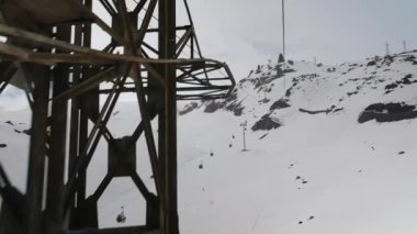 view from the ski lift to the Caucasus Mountains and other ski lifts