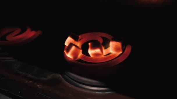 Kindling of square coal for a hookah on a special furnace with a hot spiral. — Stock Video