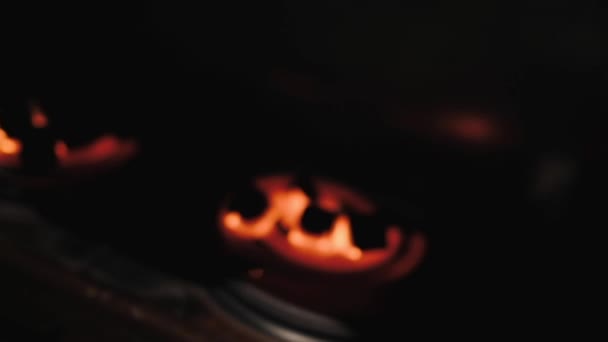 Kindling of square coal for a hookah on a special furnace with a hot spiral. — Stock Video