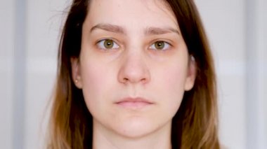 Close-up of a young woman wearing a protective medical mask, coronavirus