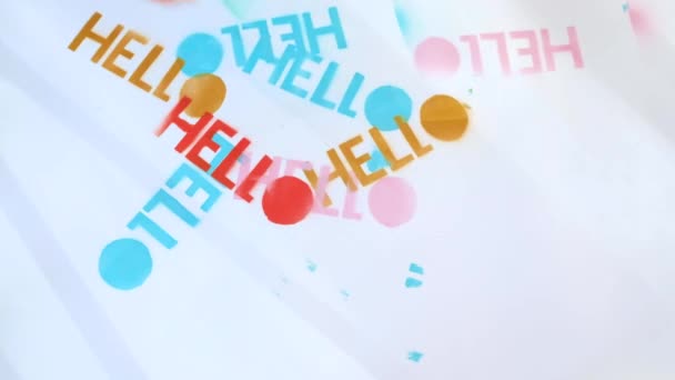 Hello. Girl writes hello on a white whatman with a spray can on a stencil. — Stock video