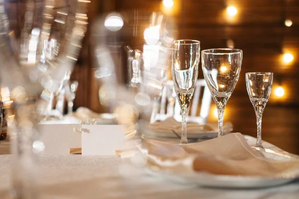 white cards for inscriptions on a white festive table against