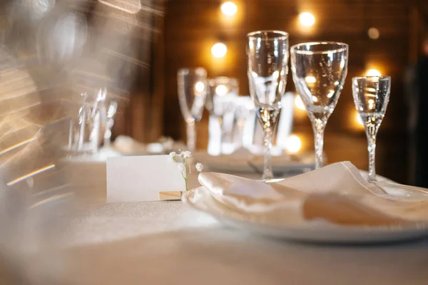 white cards for inscriptions on a white festive table against