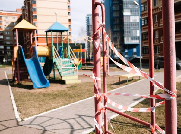 An empty playground for children in the yard. Fenced territory, coronavirus — Stock Photo, Image