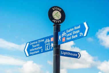 Direction signs at the seaside located at the coastal town of Morecambe in Lancashire clipart