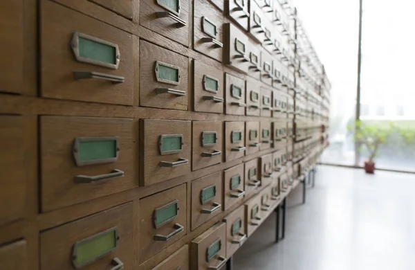 Drawers in archive with  Wooden shelves