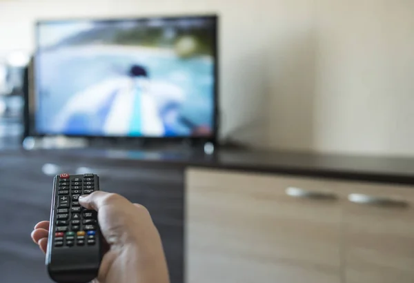 Hand hold TV remote control. — Stock Photo, Image