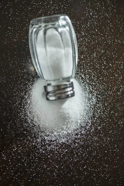 Salt shaker on pile of salt — Stock Photo, Image