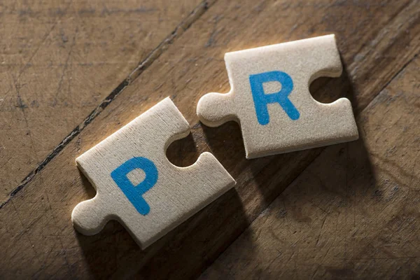 Word PR on puzzle — Stock Photo, Image