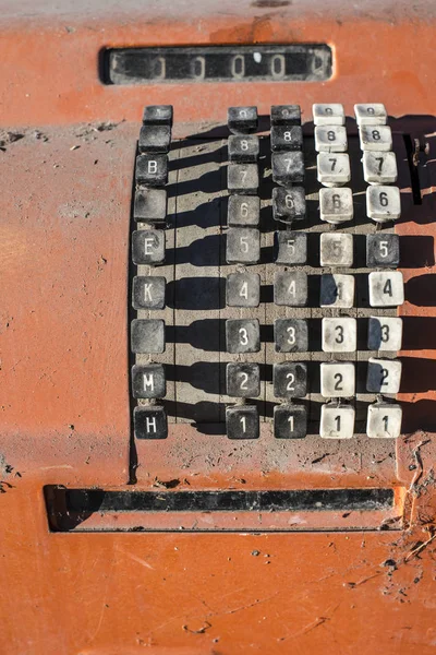 Vintage calculating machine on background