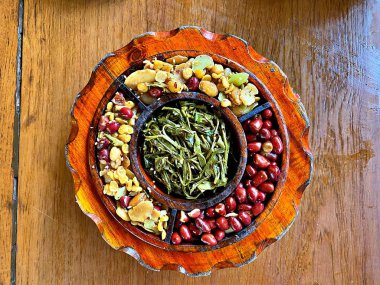 The myanmar(burmese) tea leaf (laphat) salad with variety of roasted nut, one of the most famous dish of Myanmar cuisine clipart