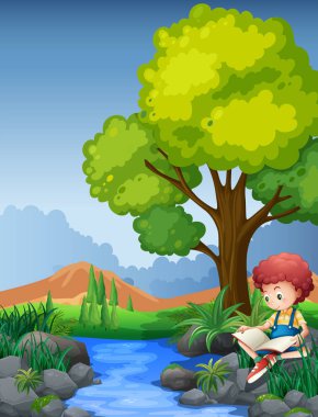 Nehir kıyısında kitap okuma ufaklık