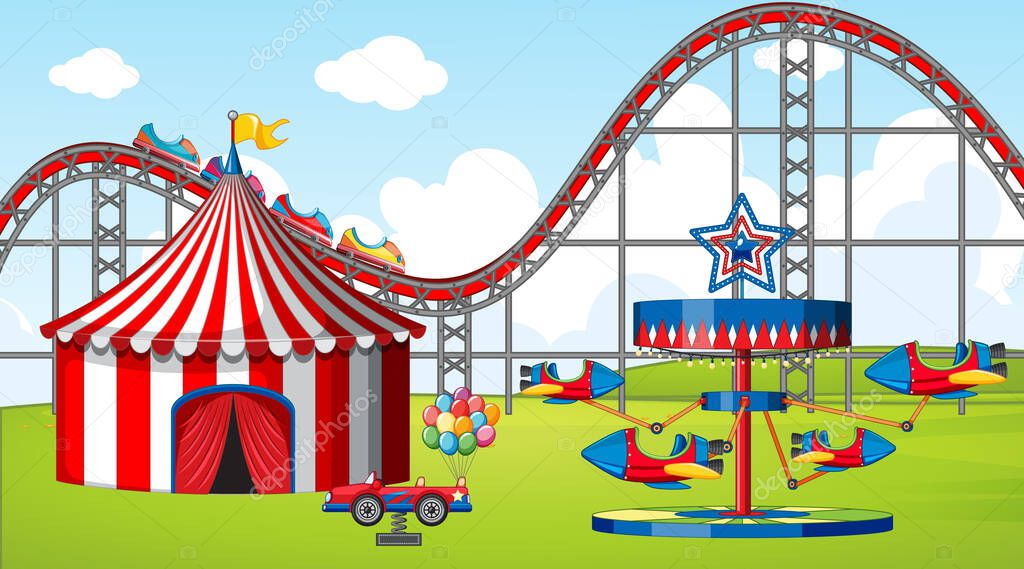 Scene with many rides and circus tent in the fiel