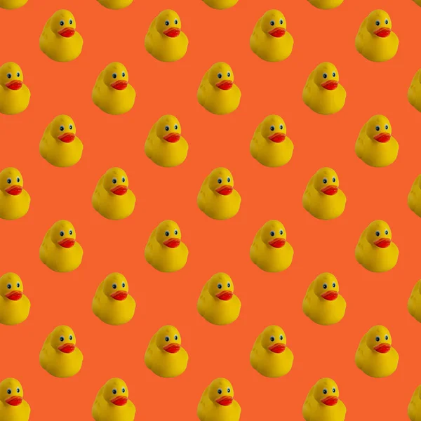 Cyfrowy bezszwowy wzór żółtej kaczki gumowej na pomarańczowym tle — Zdjęcie stockowe
