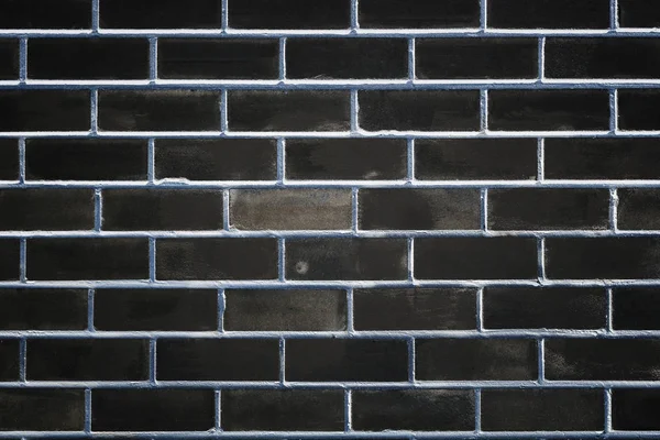 Black brick wall as a template for design. Trendy concept, space for text — Stock Photo, Image