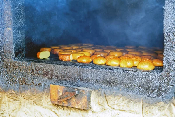 Cooking smoked cheese in the home oven. Sochi, Russia