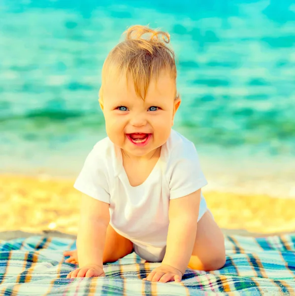 Happy infant baby enjoying at a sea resort. — Stock Photo, Image