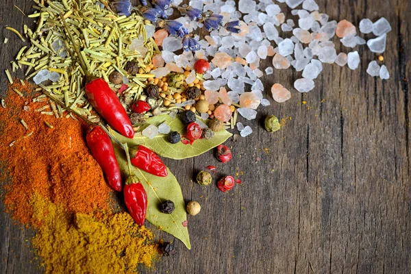 Spices for cooking on old wooden table — Stock Photo, Image