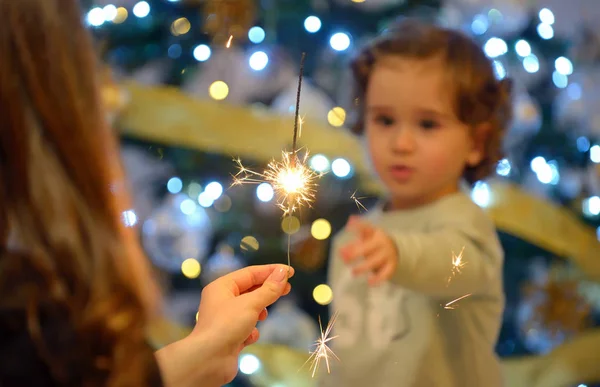 Teen girl holding sparklers — Stock Photo, Image