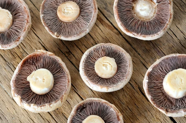 Sliced mushrooms on  wooden table — Stock Photo, Image