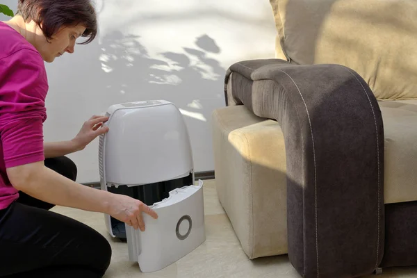 Portable dehumidifier collect water from air — Stock Photo, Image