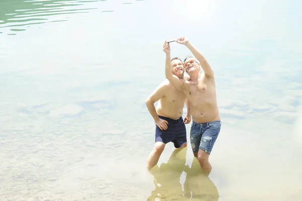 Two Men Standing Together Outdoors Taking Selfie Smiling Best Friends — Stock Photo, Image