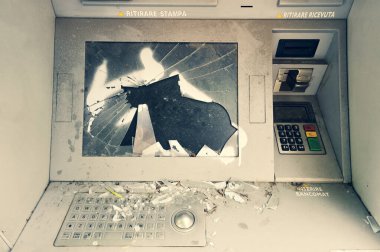 Damaged, vandalised, abandoned ghost ATM, out of order destroyed cash machine. Front view of broken, out of service auto teller machine with cracked screen. Financial and economic crisis. Regression. clipart