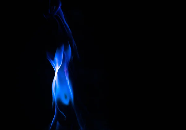 Formas de fuego con abstracción de agujeros en fondo negro —  Fotos de Stock