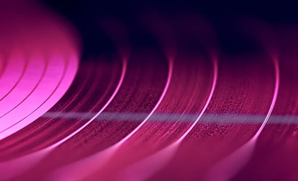 Старый красочный диск Vynil играет музыку, фоновое изображение — стоковое фото