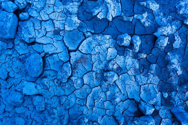 Djup blå spruckna marken bakgrund design — Stockfoto