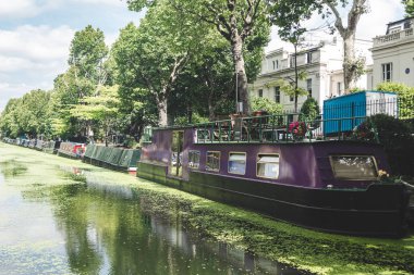 Narrowboats moored along the Regents Canal in Little Venice, Lon clipart