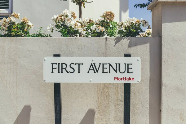 First Avenue name sign in Mortlake, suburban district in the London Borough of Richmond upon Thames, UK