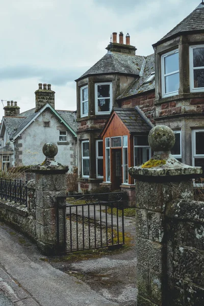 Traditional stone houses in Golspie town. Golspie is a village in Sutherland, Highland, Scotland, which lies on the North Sea coast in the shadow of Ben Bhraggie