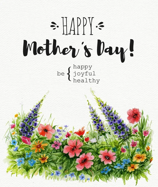 Greeting card Happy Mothers Day with lawn of wild flowers and lettering. Watercolor card on textured paper